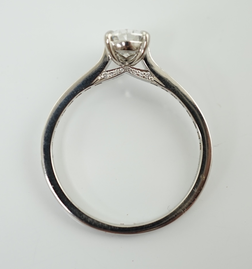 A recent Boodles platinum and single stone pear cut diamond set Harmony design ring, with diamond chip set shoulders and setting
